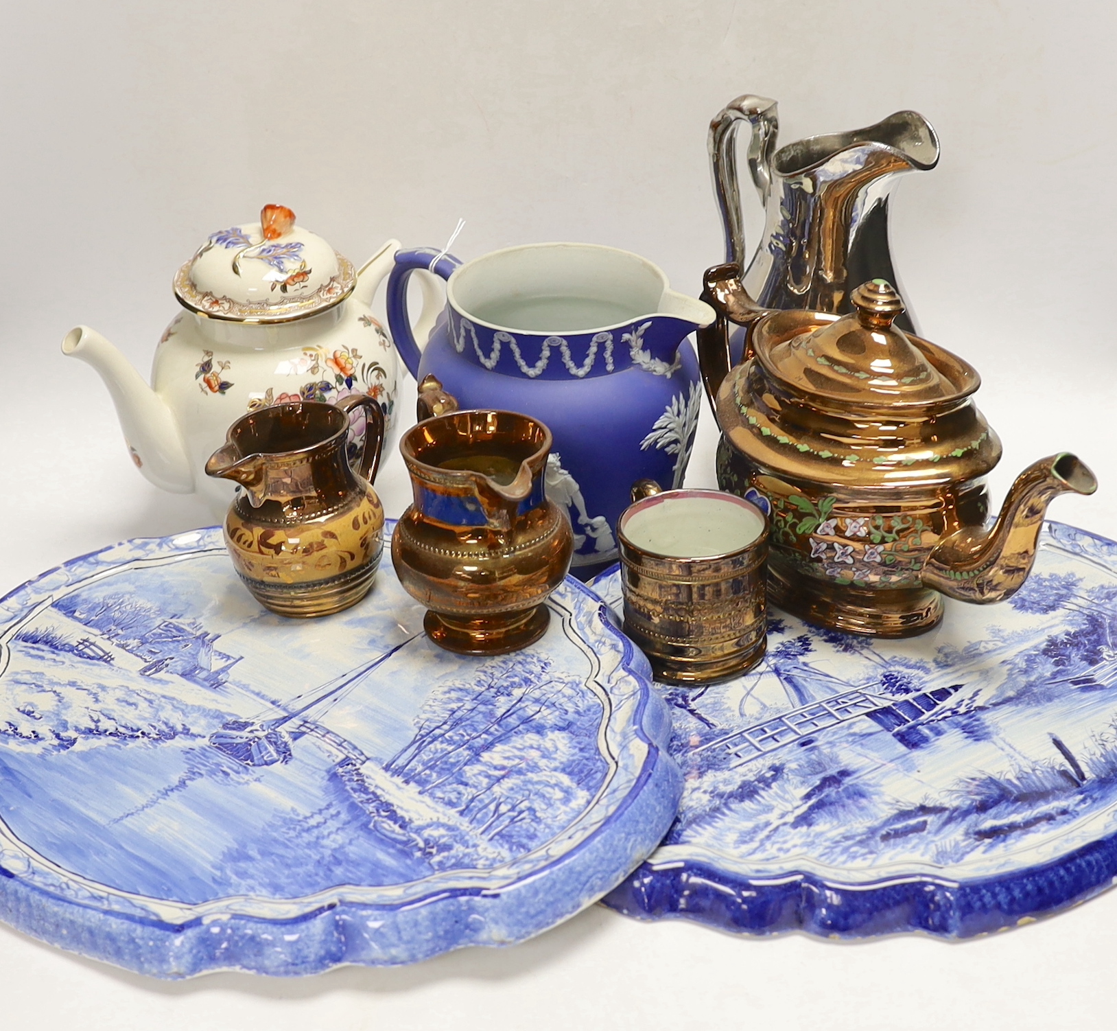 Nine ceramic items including two Dutch blue and white wall plaques, a silvered jug, a teapot, four items of lustreware and a Wedgwood jug, tallest 23cm